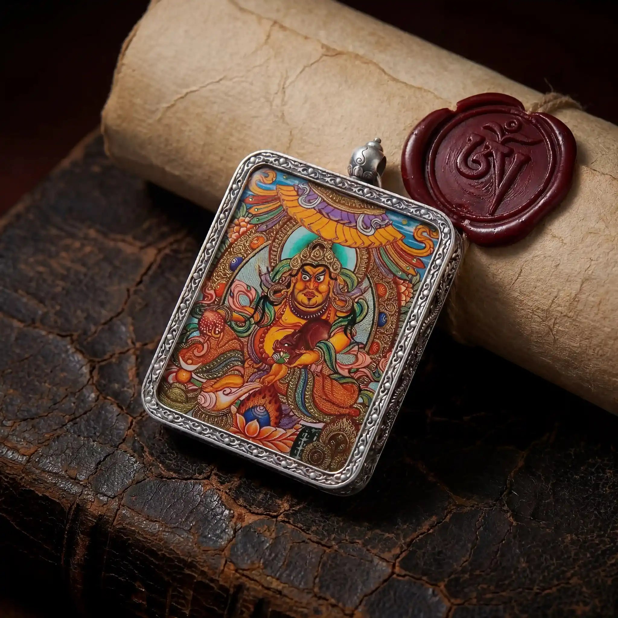 Bespoke 24K gold Yellow Jambhala miniature Thangka painted inside a seamless silver Ghau amulet pendant by BEYUL ATELIER.