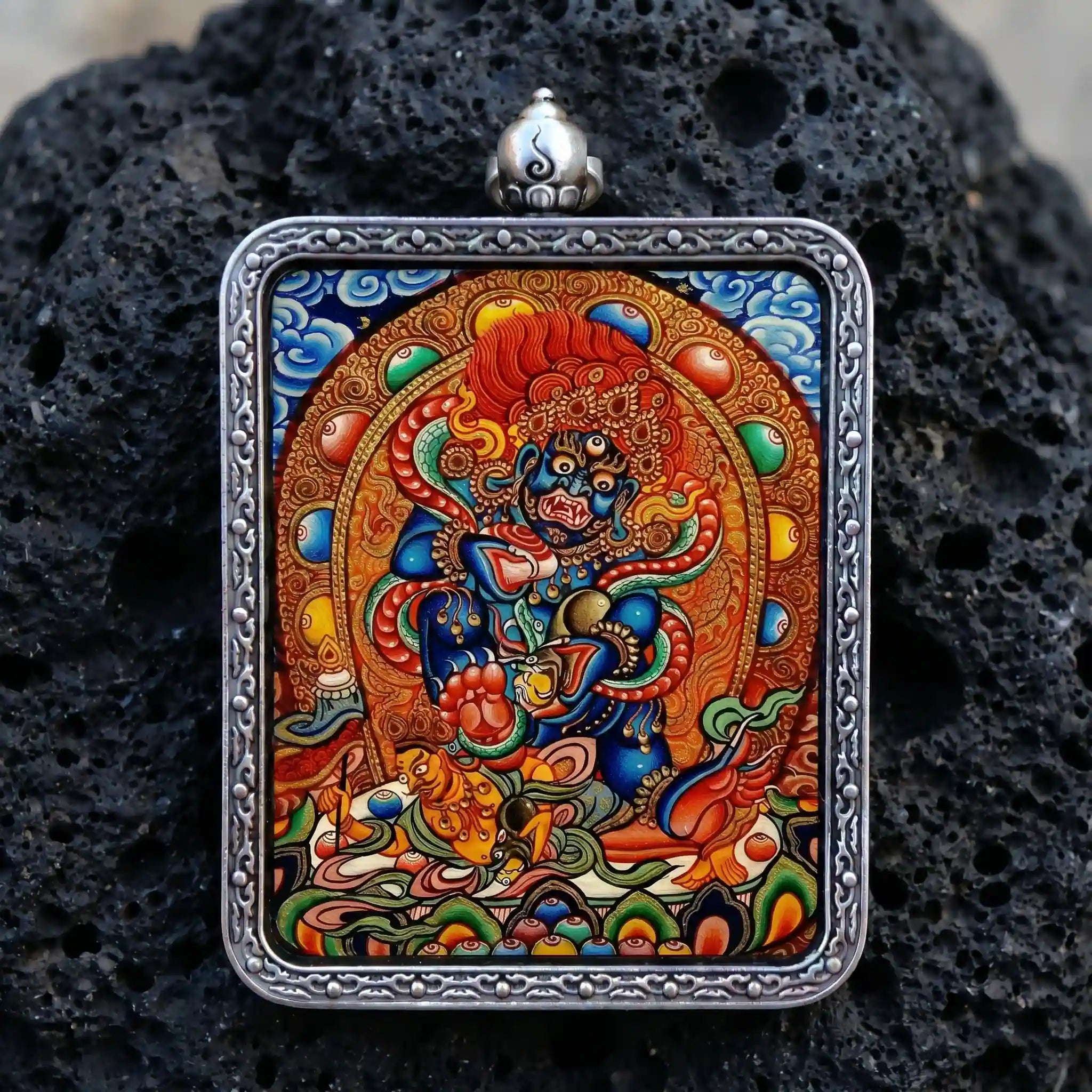 Hand-painted Black Jambhala micro-Thangka encased in a seamless solid silver Ghau pendant for energy protection and removing obstacles by BEYUL ATELIER.
