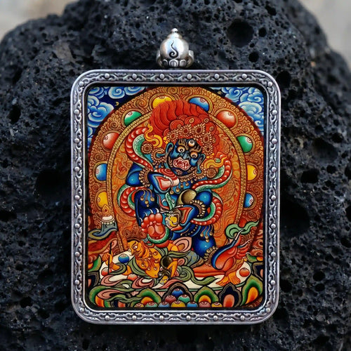 Hand-painted Black Jambhala micro-Thangka encased in a seamless solid silver Ghau pendant for energy protection and removing obstacles by BEYUL ATELIER.