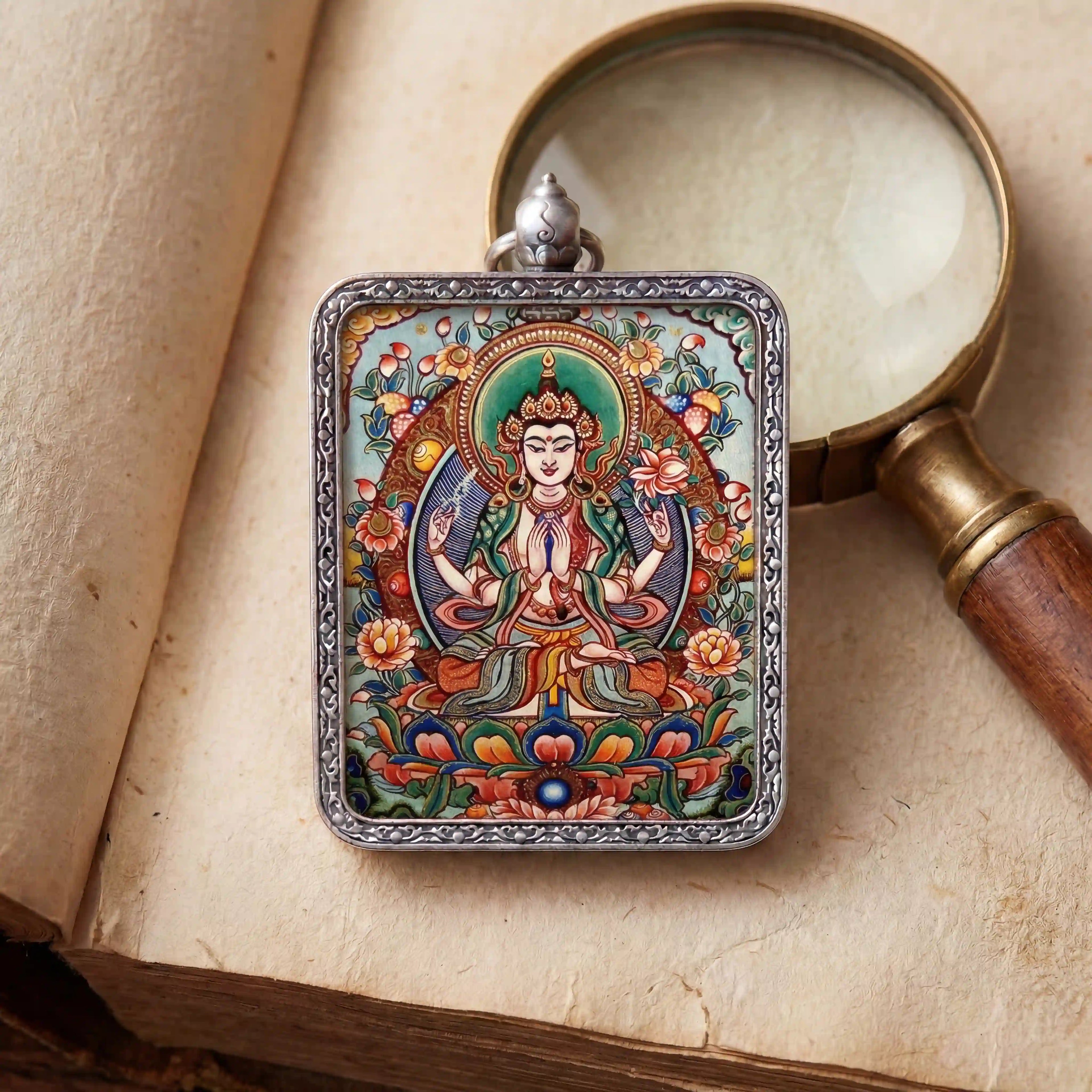 Bespoke Four-Armed Avalokiteshvara miniature Thangka pendant, luxury spiritual jewelry for compassion and inner peace, hand-painted inside a silver amulet box by BEYUL ATELIER.