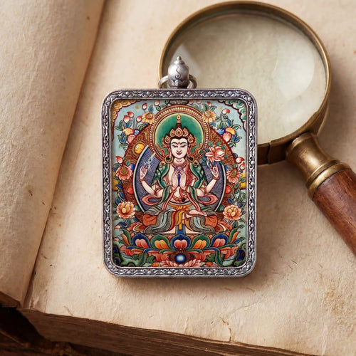 Bespoke Four-Armed Avalokiteshvara miniature Thangka pendant, luxury spiritual jewelry for compassion and inner peace, hand-painted inside a silver amulet box by BEYUL ATELIER.